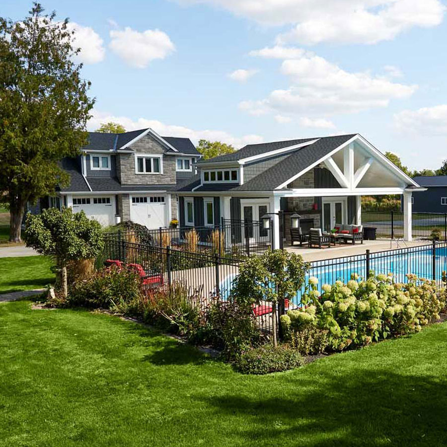 Landscaped personal paradise with a pool house, guesthouse and gardens.