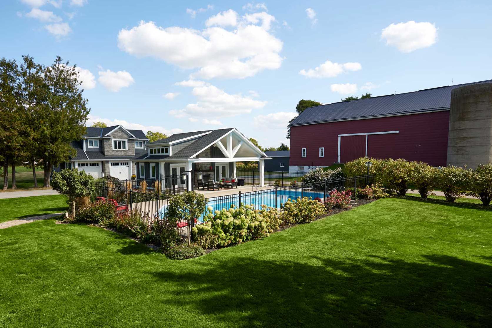 A large estate with a pool house, guest house, extra garage and farmhouse supported by a larger septic system and trenched gas, electoral communications, water and sewer lines.
