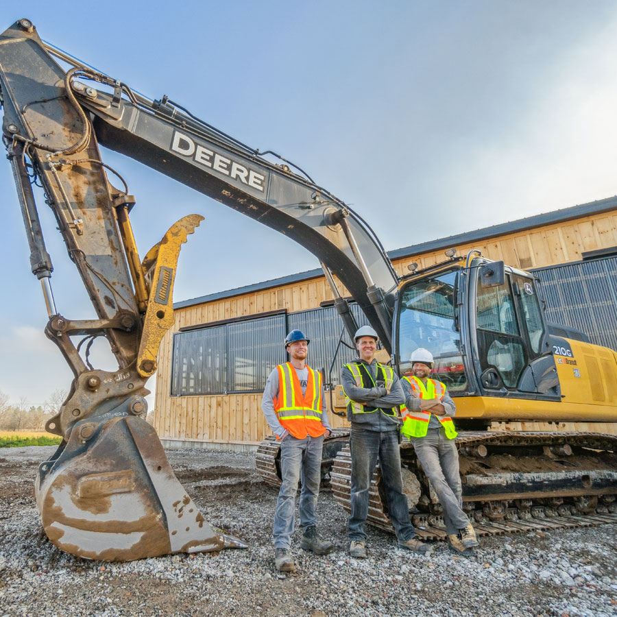Advanced Excavating's crew with an excavator, the excavation contractor subcontracted to overcome skilled labour shortages for Ontario contractors.